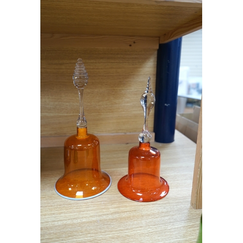 430 - Five hand bells comprising an amber glass example with twist handle, two orange and two green glass ... 