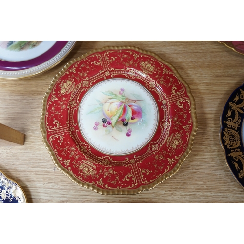 439 - A collection of English porcelain plates, highlights include a Royal Doulton fruit painted cabinet p... 