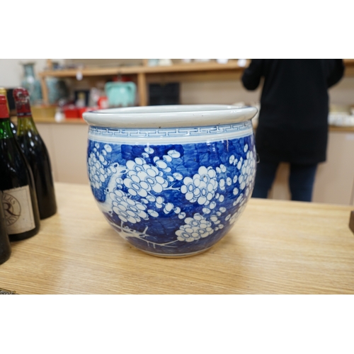 447 - A large Chinese blue and white prunus flower planter, 32cm in diameter. Condition - fair to good... 