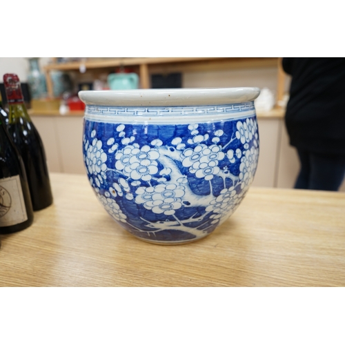 447 - A large Chinese blue and white prunus flower planter, 32cm in diameter. Condition - fair to good... 