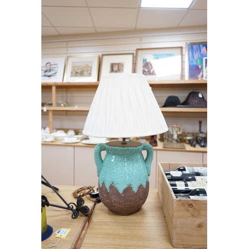 451 - A turquoise lava ceramic table lamp with fabric shade, wired, 65cm high to top of shade. Condition -... 