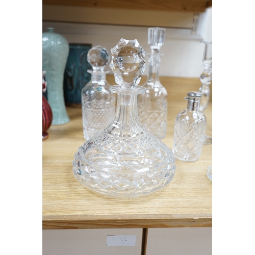 456 - A cut glass ships decanter, two others and three various cut glass candle sticks, tallest decanter ... 