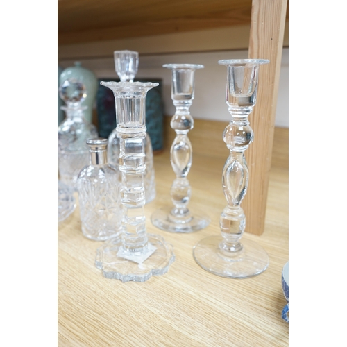 456 - A cut glass ships decanter, two others and three various cut glass candle sticks, tallest decanter ... 