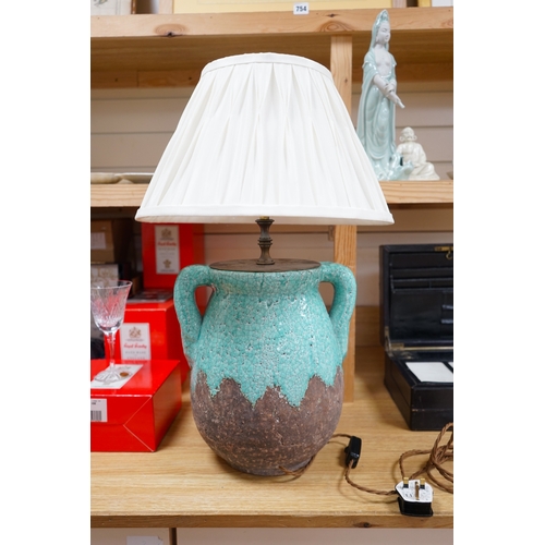 469 - A turquoise lava ceramic table lamp with fabric shade, wired, 61cm to top of shade, 33cm high exclud... 