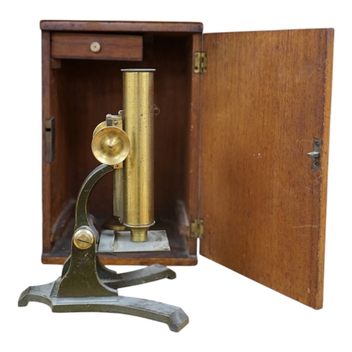 481 - A Victorian brass microscope, J T Slugg, Manchester, in original wooden case, with a small selection... 