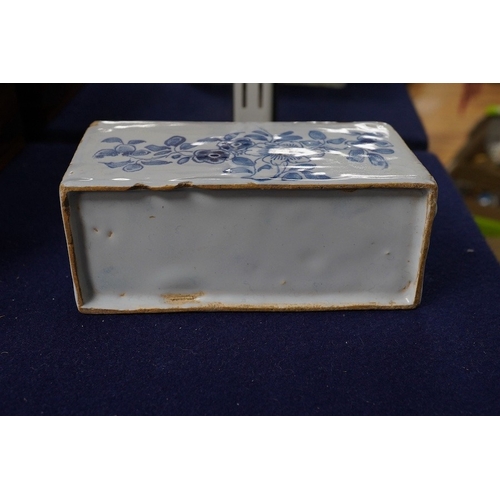 488 - An 18th century English delftware flower brick, 15cm wide, 8cm high. Condition - edges chipped and l... 