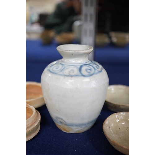 489 - A group of Thai or Annamese miniature pottery vessels and a small blue and white vase, vase 9.5cm hi... 