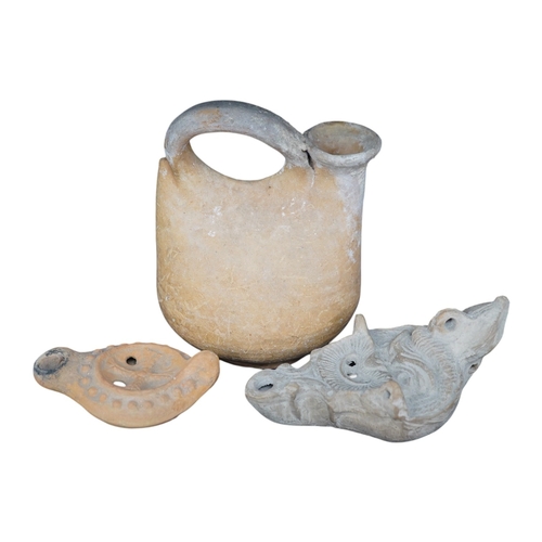 491 - Three ancient pottery vessels, including an askos, largest 14cm high. Condition - good for age and u... 