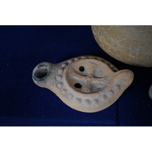 491 - Three ancient pottery vessels, including an askos, largest 14cm high. Condition - good for age and u... 