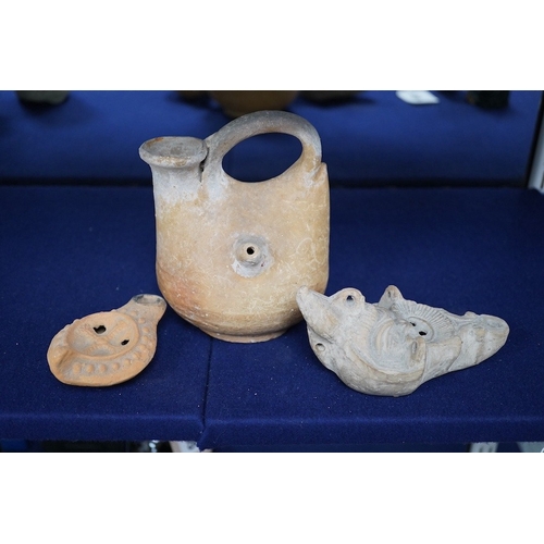 491 - Three ancient pottery vessels, including an askos, largest 14cm high. Condition - good for age and u... 