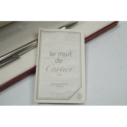 494 - A Cartier pen, 14cm long, boxed. Condition - good