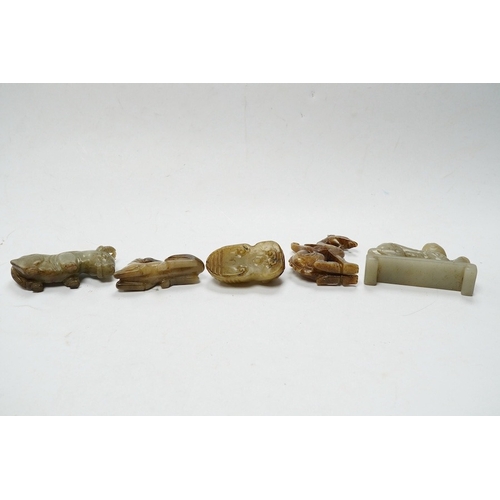 502 - Four Chinese jade carvings, of a horse, cicada, a winged beast, a kneeling man, and a horned beast, ... 