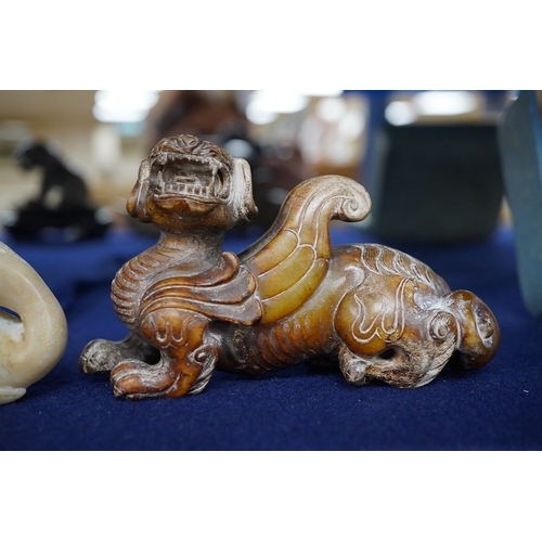 507 - Three Chinese archaistic jade carvings of a winged mythical beast, a duck and a horned seated beast,... 