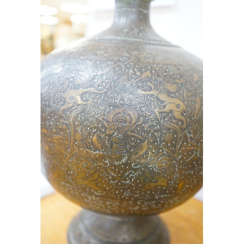 508 - A large Indian repoussé work brass vase, 62cm high. Condition - good