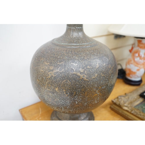 508 - A large Indian repoussé work brass vase, 62cm high. Condition - good