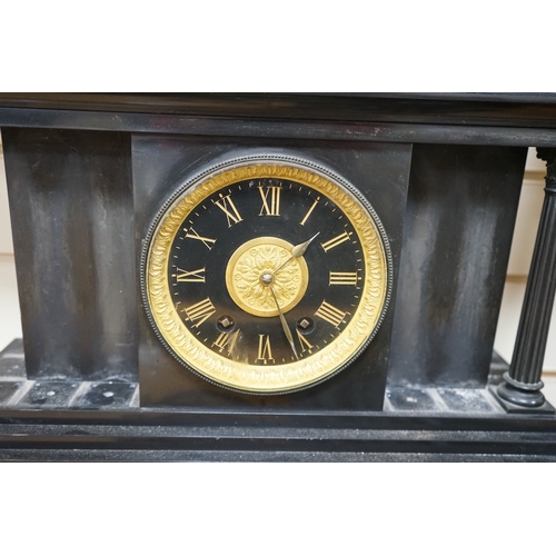 510 - A Victorian black slate mantel clock, 54.5cm wide. Condition - columns and some clock parts loose... 