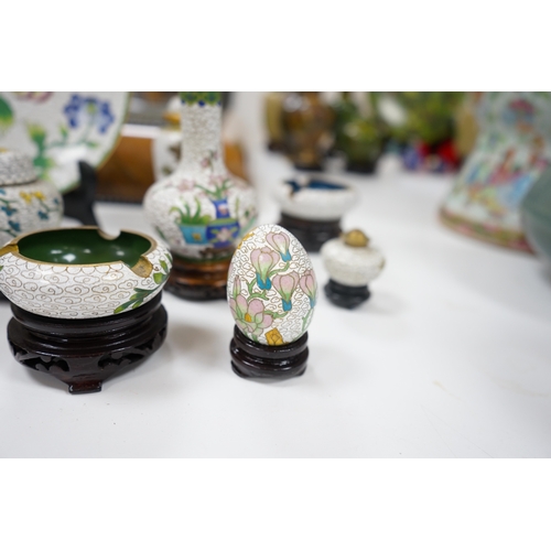 522 - A collection of Chinese cloisonné enamel vases, pots etc., all worked on a white background in flora... 