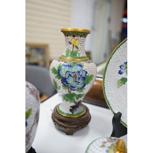 522 - A collection of Chinese cloisonné enamel vases, pots etc., all worked on a white background in flora... 