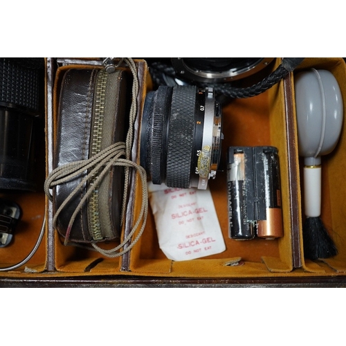 525 - A cased Olympus camera, lenses and equipment, Condition - poor