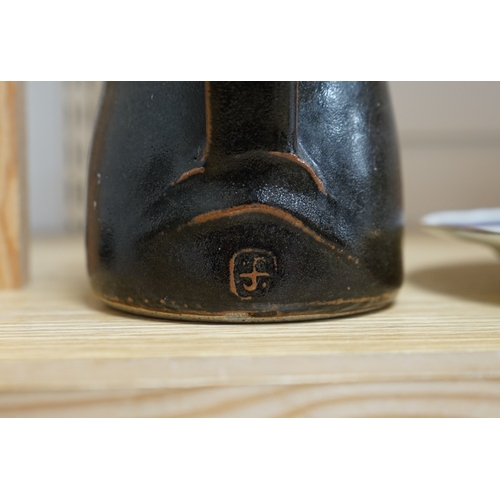 527 - Leach standard ware, a small Stoneware black glazed studio pottery jug, impressed mark to top of foo... 