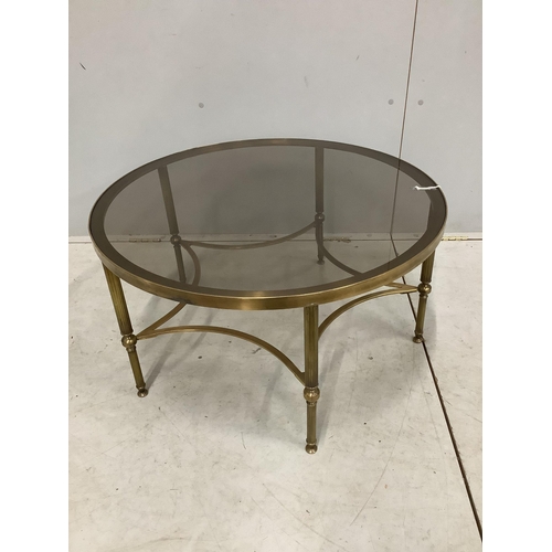 56 - A Maison Jansen style circular brass glass top coffee table. Diameter 77cm, height 41cm, Condition -... 