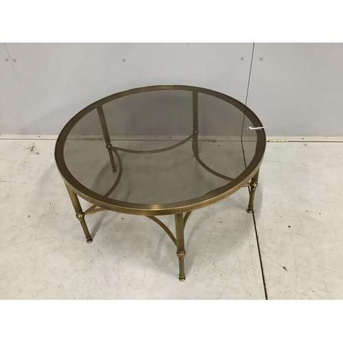 56 - A Maison Jansen style circular brass glass top coffee table. Diameter 77cm, height 41cm, Condition -... 