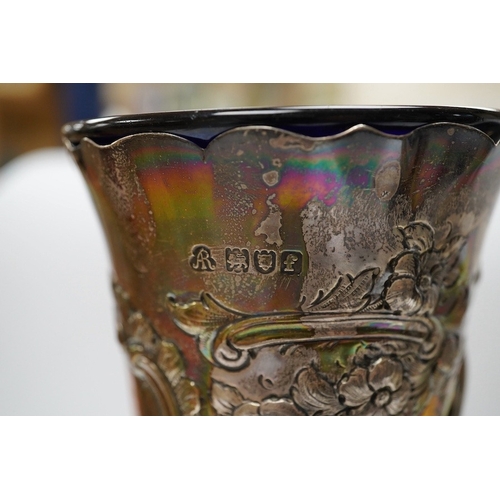 826 - An Edwardian silver vase, embossed with hunting scene, with blue glass liner, Manoah Rhodes & Sons L... 