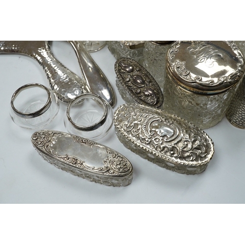 832 - Two silver mounted hand mirrors and a collection of seventeen assorted silver mounted toilet jars. C... 