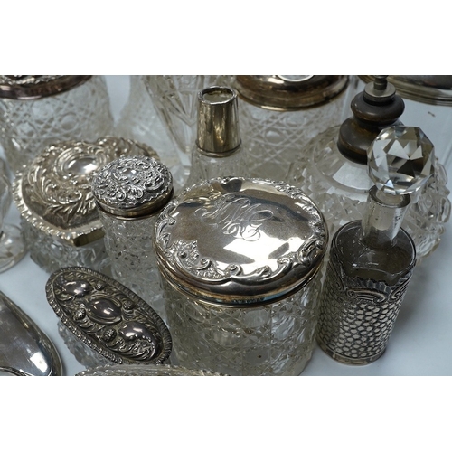 832 - Two silver mounted hand mirrors and a collection of seventeen assorted silver mounted toilet jars. C... 