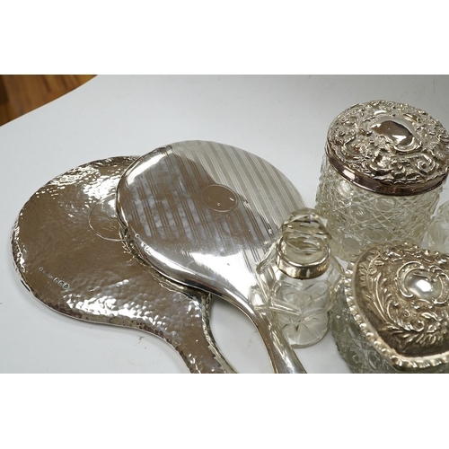 832 - Two silver mounted hand mirrors and a collection of seventeen assorted silver mounted toilet jars. C... 