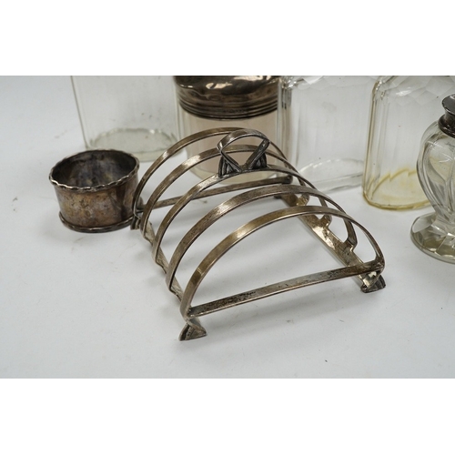 839 - An Art Deco silver five bar toast rack by Charles S. Green & Co Ltd, Birmingham, 1935, 9cm, a silver... 