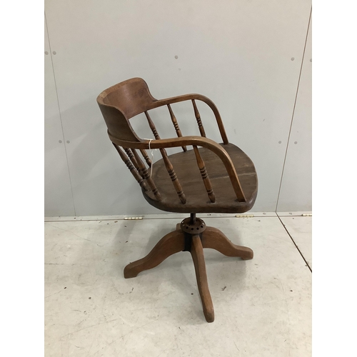 84 - An early 20th century oak swivel desk chair, width 54cm, depth 46cm, height 85cm. Condition - poor... 