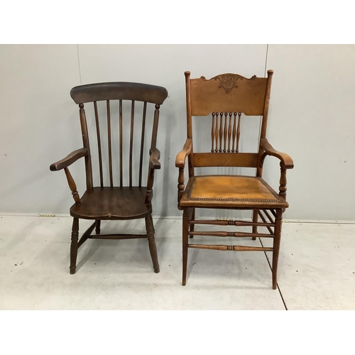 88 - A Victorian Windsor comb back armchair, reduced and an early 20th century American oak elbow chair, ... 