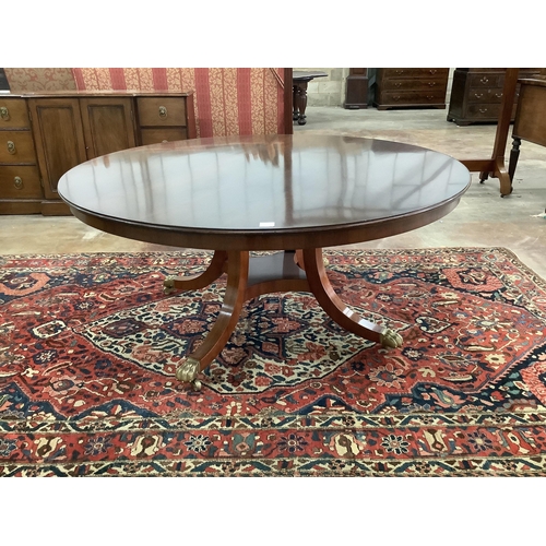 90 - A reproduction George III style mahogany circular segmental extending dining table, diameter  155cm,... 