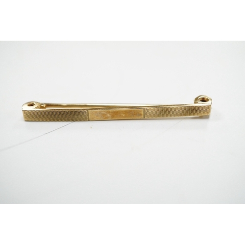 902 - Four assorted 9ct gold chains or necklaces and a 9ct gold bar brooch, 14.7 grams. Condition - fair t... 