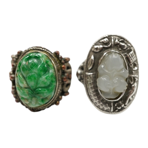 906 - Two Chinese or Burmese jadeite or jade mounted white metal rings. Condition - fair