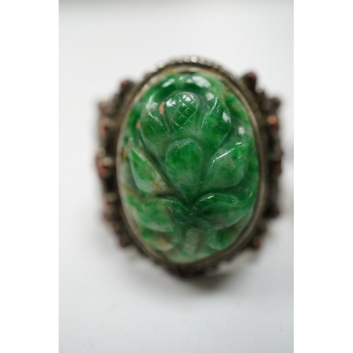 906 - Two Chinese or Burmese jadeite or jade mounted white metal rings. Condition - fair