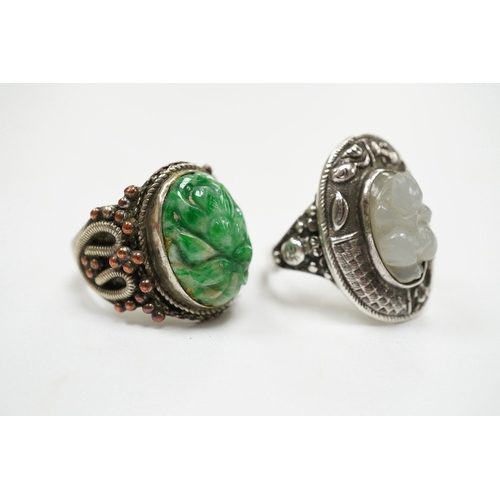 906 - Two Chinese or Burmese jadeite or jade mounted white metal rings. Condition - fair