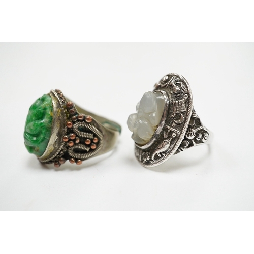 906 - Two Chinese or Burmese jadeite or jade mounted white metal rings. Condition - fair