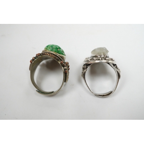 906 - Two Chinese or Burmese jadeite or jade mounted white metal rings. Condition - fair