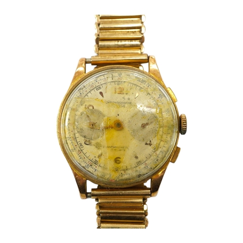 907 - A gentleman's yellow metal Swiss chronograph manual wind wrist watch (lacking back cover), on a gold... 