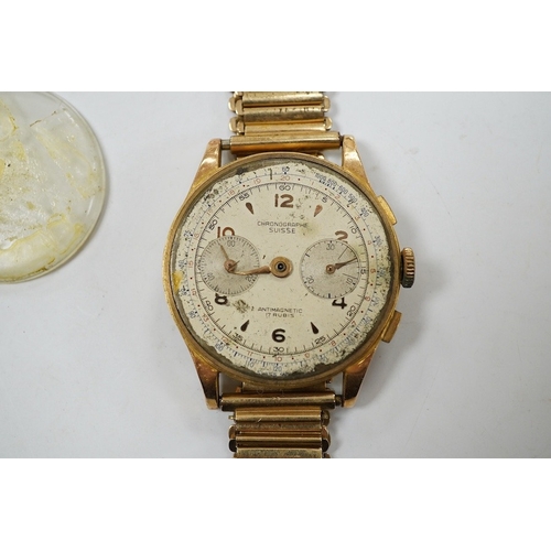 907 - A gentleman's yellow metal Swiss chronograph manual wind wrist watch (lacking back cover), on a gold... 