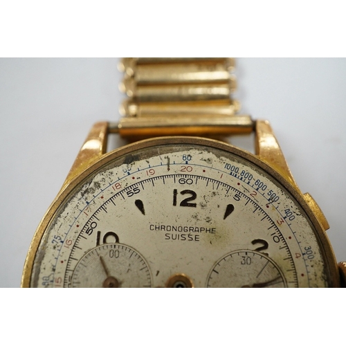 907 - A gentleman's yellow metal Swiss chronograph manual wind wrist watch (lacking back cover), on a gold... 