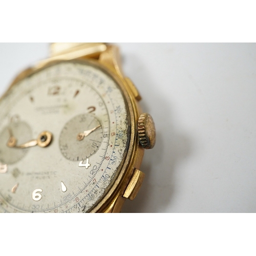 907 - A gentleman's yellow metal Swiss chronograph manual wind wrist watch (lacking back cover), on a gold... 