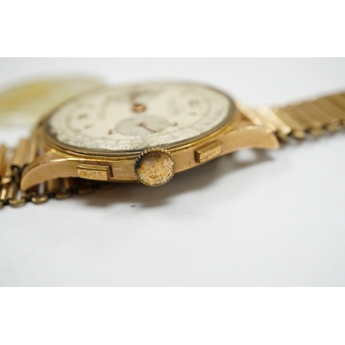 907 - A gentleman's yellow metal Swiss chronograph manual wind wrist watch (lacking back cover), on a gold... 