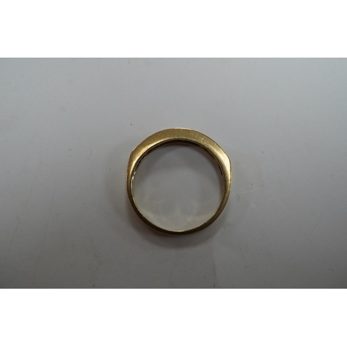 908 - A modern 9ct gold and channel set sapphire and diamond set half hoop ring, size N/O, gross weight 2.... 