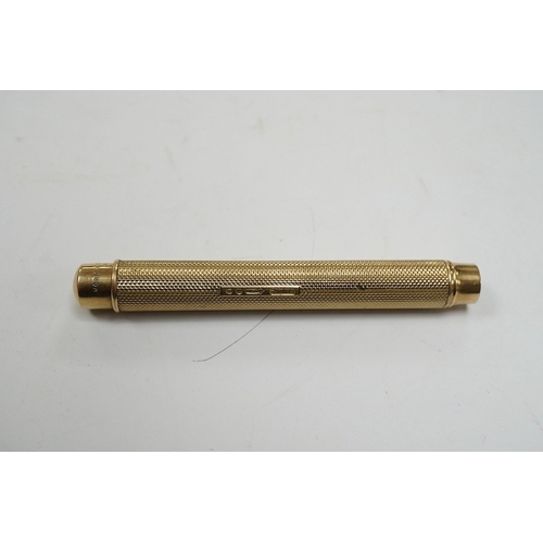 911 - A George V 9ct gold cased propelling pencil by Sampson Mordan & Co, London, 1928. Condition - fair t... 