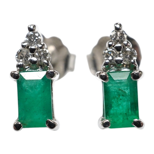 916 - A small modern pair of 14k white metal, emerald and diamond cluster set ear studs, 9mm, gross weight... 