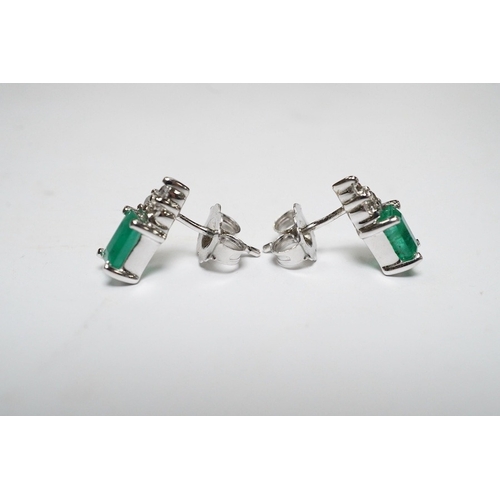 916 - A small modern pair of 14k white metal, emerald and diamond cluster set ear studs, 9mm, gross weight... 