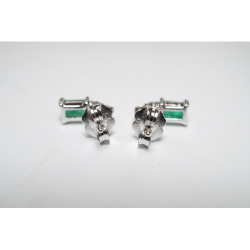 916 - A small modern pair of 14k white metal, emerald and diamond cluster set ear studs, 9mm, gross weight... 